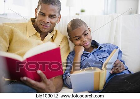 Father and son reading books View Large Photo Image Stock Image - Father and son reading books. Fotosearch