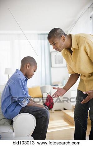 Father lecturing son View Large Photo Image Stock Image - Father lecturing son. Fotosearch