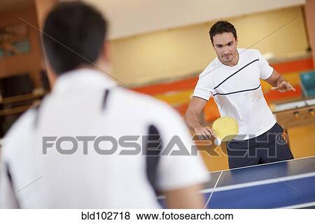 Hispanic men playing ping pong View Large Photo Image Stock Photo - Hispanic men playing ping pong. Fotosearch