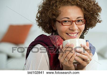 Hispanic woman drinking coffee View Large Photo Image Stock Image - Hispanic woman drinking coffee. Fotosearch