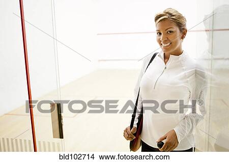 Hispanic woman leaving squash court View Large Photo Image Picture - Hispanic woman leaving squash court. Fotosearch