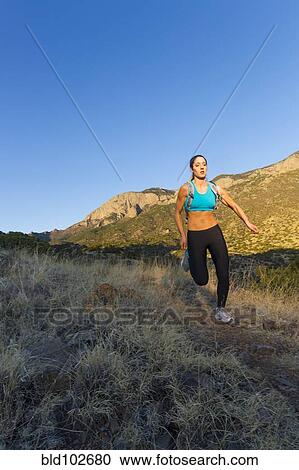 Hispanic woman running in remote area View Large Photo Image Stock Image - Hispanic woman running in remote area. Fotosearch