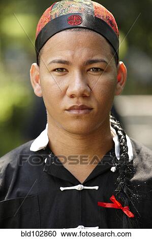 Man in traditional Asian clothing View Large Photo Image Stock Image - Man in traditional Asian clothing. Fotosearch