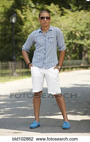 Man standing on path in park View Large Photo Image Stock Image - Man standing on path in park. Fotosearch