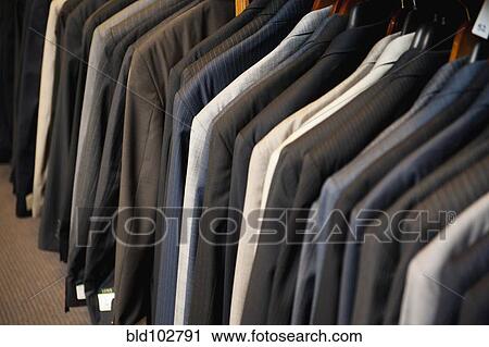 Men's suit jackets in clothing store View Large Photo Image Stock Image - Men's suit jackets in clothing store. Fotosearch