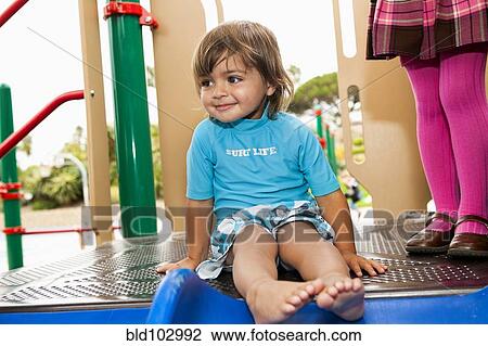 Mixed race boy on playground structure View Large Photo Image Stock Image - Mixed race boy on playground structure. Fotosearch