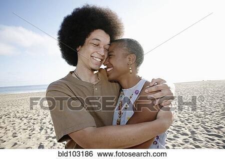 Mother and son hugging on beach View Large Photo Image Stock Photograph - Mother and son hugging on beach. Fotosearch