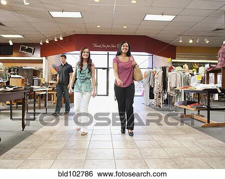 People shopping in clothing store View Large Photo Image Stock Photograph - People shopping in clothing store. Fotosearch