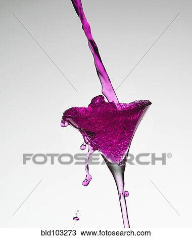 Pink liquid filling martini glass View Large Photo Image Stock Image - Pink liquid filling martini glass. Fotosearch