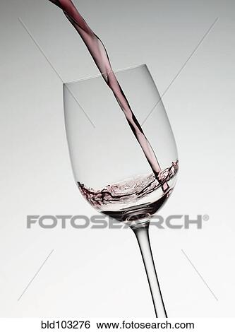 Red wine filling wine glass View Large Photo Image Stock Photograph - Red wine filling wine glass. Fotosearch