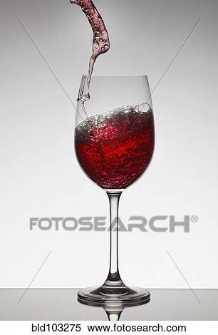 Red wine filling wine glass View Large Photo Image Stock Photography - Red wine filling wine glass. Fotosearch