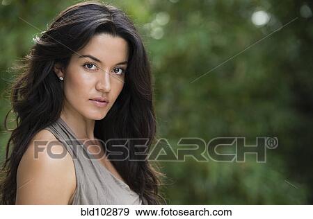 Stock Photo - Serious Hispanic woman. Fotosearch