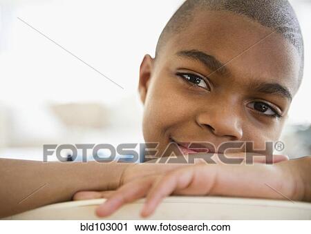 Stock Image - Smiling African American boy. Fotosearch