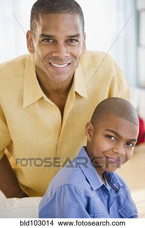 Smiling father and son View Large Photo Image Picture - Smiling father and son. Fotosearch