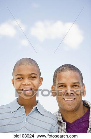 Smiling father and son View Large Photo Image Picture - Smiling father and son. Fotosearch