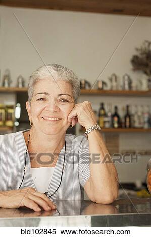 Smiling Hispanic woman in cafe View Large Photo Image Stock Photography - Smiling Hispanic woman in cafe. Fotosearch
