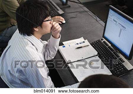 Asian student studying in computer lab View Large Photo Image Stock Image - Asian student studying in computer lab. Fotosearch