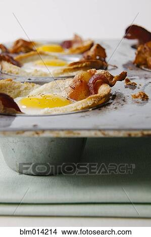 Bacon and eggs in muffin tin View Large Photo Image Picture - Bacon and eggs in muffin tin. Fotosearch