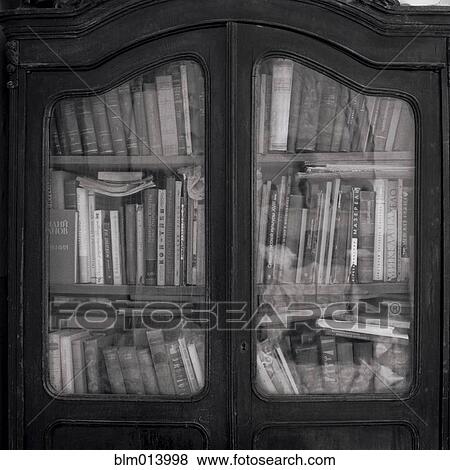 Stock Photo - Books in wooden cabinet. Fotosearch