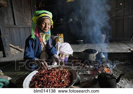 Stock Photo - Burmese woman cooking traditional cuisine. Fotosearch