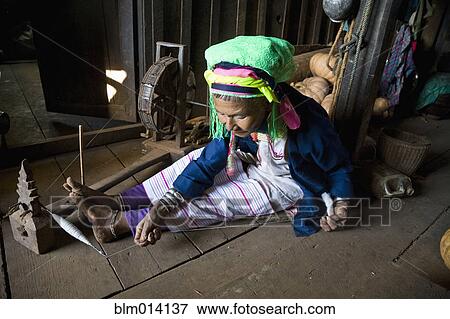 Stock Photo - Burmese woman winding string. Fotosearch