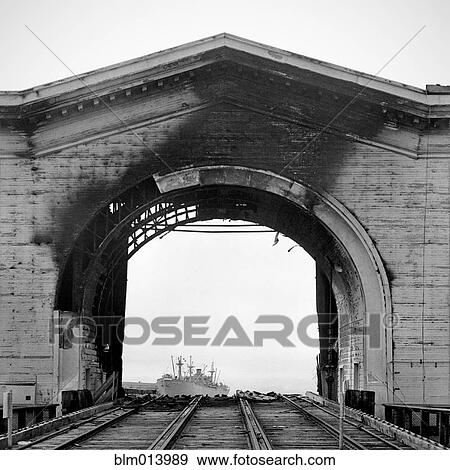 Burned arch over railroad tracks View Large Photo Image Stock Photo - Burned arch over railroad tracks. Fotosearch