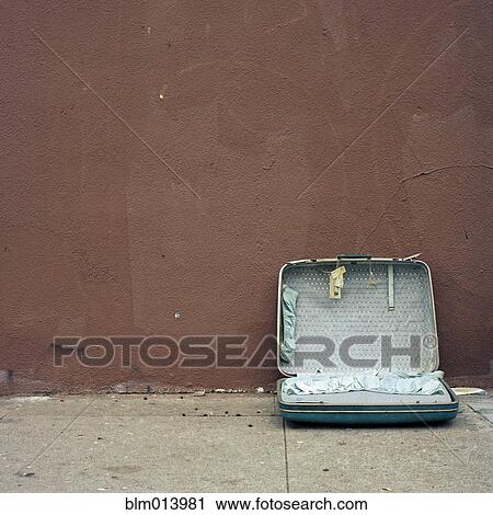 Discarded suitcase on sidewalk View Large Photo Image Stock Image - Discarded suitcase on sidewalk. Fotosearch