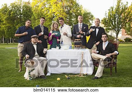 Friends enjoying elegant lawn party View Large Photo Image Stock Photography - Friends enjoying elegant lawn party. Fotosearch