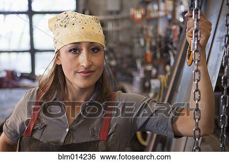 Hispanic worker in factory View Large Photo Image Stock Photograph - Hispanic worker in factory. Fotosearch