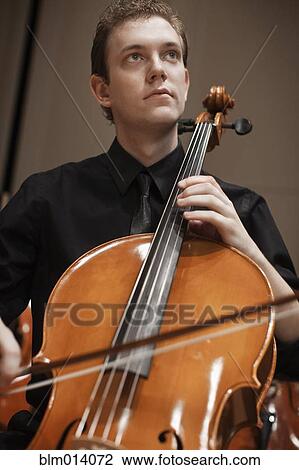 Man playing cello View Large Photo Image Stock Image - Man playing cello. Fotosearch