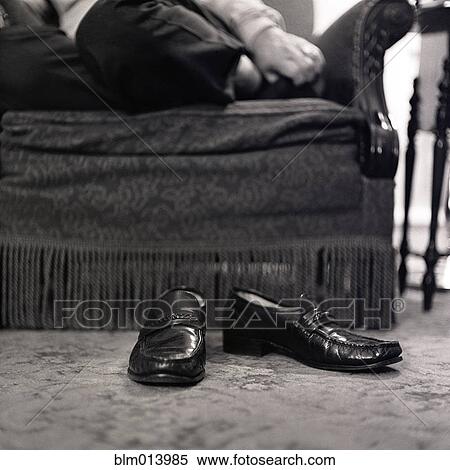 Man's shoes on floor in living room View Large Photo Image Stock Photography - Man's shoes on floor in living room. Fotosearch