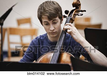 Musician playing cello View Large Photo Image Stock Image - Musician playing cello. Fotosearch