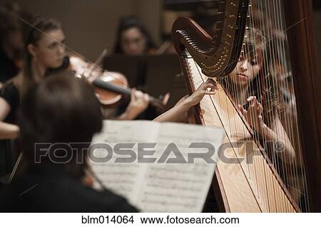 Picture - Musicians playing orchestra together. Fotosearch