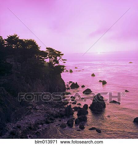 Ocean and cliffs at sunset View Large Photo Image Stock Image - Ocean and cliffs at sunset. Fotosearch
