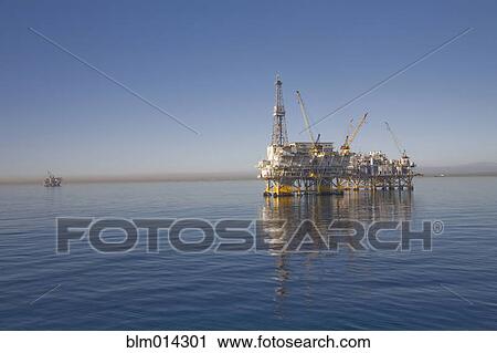 Oil rig on the ocean View Large Photo Image Stock Image - Oil rig on the ocean. Fotosearch