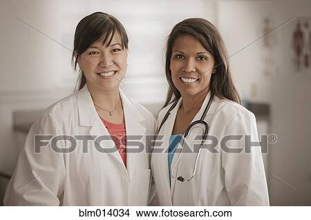 Picture - Smiling doctor standing together. Fotosearch