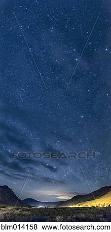 Stock Photo - Stars in night sky over Yellowstone National Park. Fotosearch