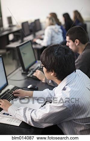 Stock Photo - Students studying in computer lab. Fotosearch