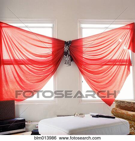 Stock Photograph - Unusual red curtains in living room. Fotosearch