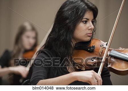 Women playing violin View Large Photo Image Stock Photo - Women playing violin. Fotosearch