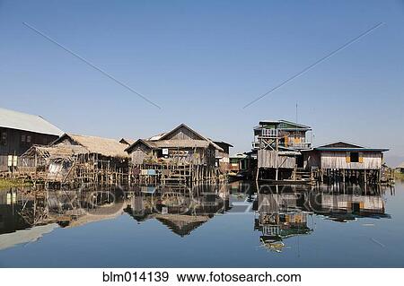 Stock Photo - Wooden houses over water. Fotosearch