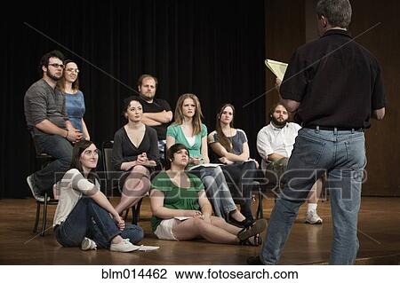 Stock Image - Actors rehearsing on stage. Fotosearch