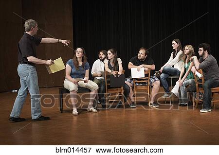 Stock Photo - Actors rehearsing on stage. Fotosearch