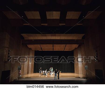Stock Photograph - Actors rehearsing on stage. Fotosearch