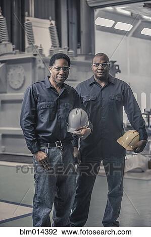 African American workers standing together in factory View Large Photo Image Stock Image - African American workers standing together in factory. Fotosearch