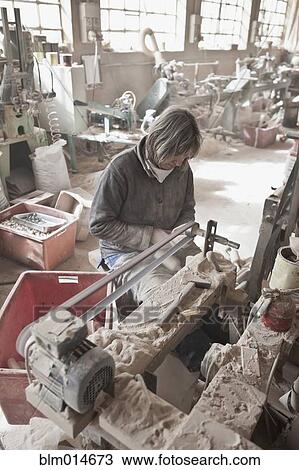 Carpenter working in woodshop View Large Photo Image Stock Image - Carpenter working in woodshop. Fotosearch