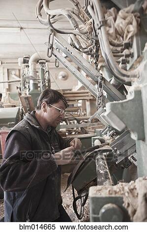 Carpenter working in woodshop View Large Photo Image Stock Photography - Carpenter working in woodshop. Fotosearch