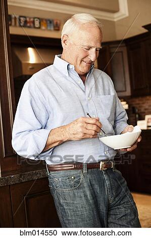 Caucasian man holding bowl View Large Photo Image Stock Image - Caucasian man holding bowl. Fotosearch
