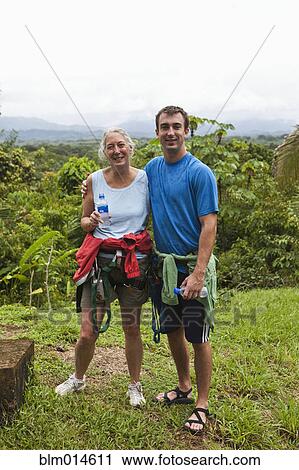 Stock Image - Caucasian mother and son standing together. Fotosearch