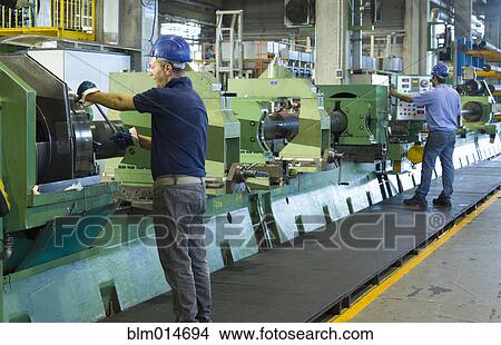 Caucasian workers working in steel factory View Large Photo Image Picture - Caucasian workers working in steel factory. Fotosearch